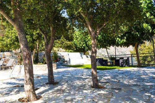 a group of trees in a park at Somnia Villa, a place of dreams, By ThinkVilla in Asigonía