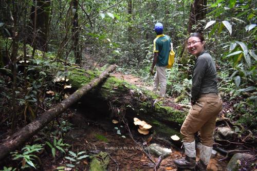 two men standing on a trail in the woods at Sinharaja Kurulu Ella Eco Resort in Deniyaya