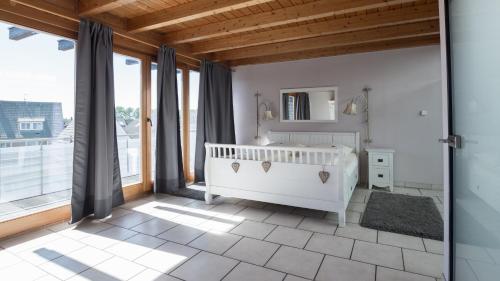 Ένα ή περισσότερα κρεβάτια σε δωμάτιο στο Hotel Garni Landhaus zur Issel