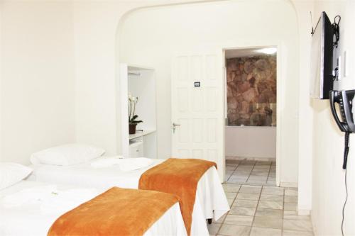 Tempat tidur dalam kamar di Hotel Portal do Descobrimento