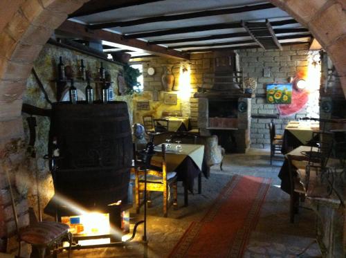 a dining room with a table and a fireplace at AgriSesto B&B in Fregene
