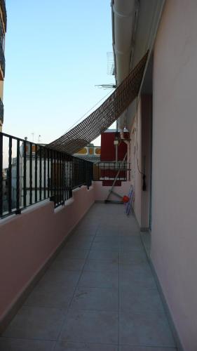 an empty hallway of a building with a balcony at Apartamento Portalet 7 in Benaguacil