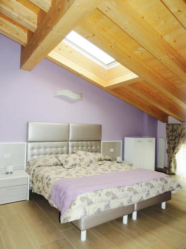 Ένα ή περισσότερα κρεβάτια σε δωμάτιο στο B&B La Casa di Rosa