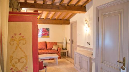 a living room with a red couch in a room at Hotel Hermitage in Portoferraio