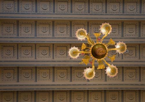 a chandelier hanging from the ceiling of a room at Heritage Hotel Cardo in Split