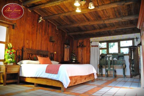 Cama o camas de una habitación en Hotel Hacienda Don Juan