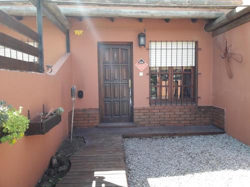 a entrance to a house with a door at Apart Piedra Libre in Tandil
