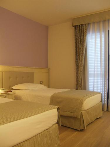 Кровать или кровати в номере Hotel Girifalco - Nature & Relax