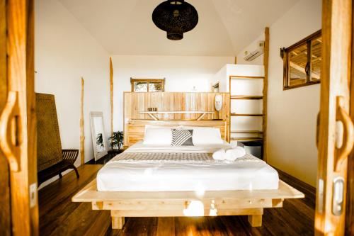 Katil atau katil-katil dalam bilik di Maligaya Beach Bungalows