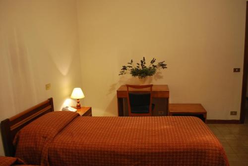 Cama o camas de una habitación en Albergo Smeraldo