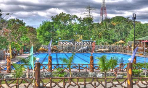 a large swimming pool in a theme park at Bosay Resort in Antipolo