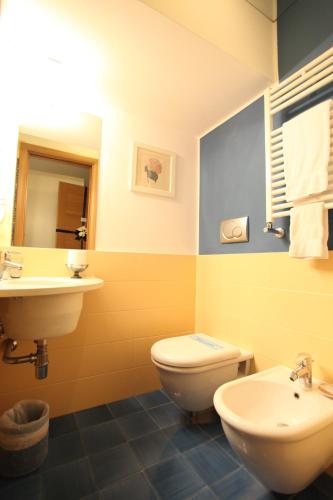 a bathroom with a toilet and a sink at B&B Orsini 46 in Naples