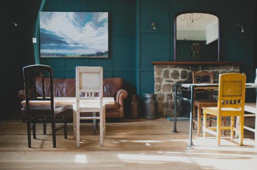 a room with chairs and a table and a couch at Norfolk Arms Hotel in Arundel