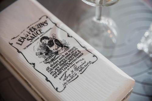 a white napkin sitting on a table with a wine glass at Piernikowy Domek in Toruń
