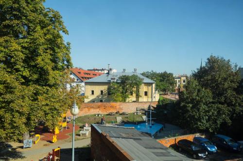 a view of a city with cars parked on a street at Piernikowy Domek in Toruń