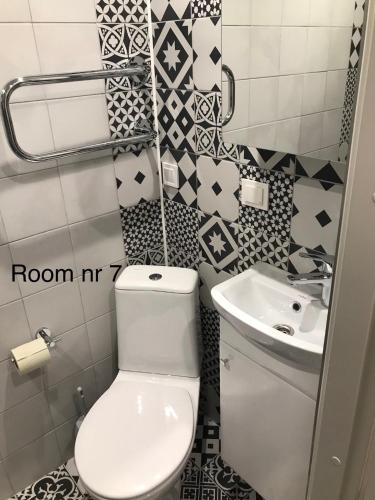 a bathroom with a toilet and a sink at Liivalaia 40 cozy kitchen studio in Tallinn