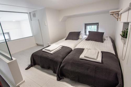 Spot Apartments Tikkurila tesisinde bir odada yatak veya yataklar