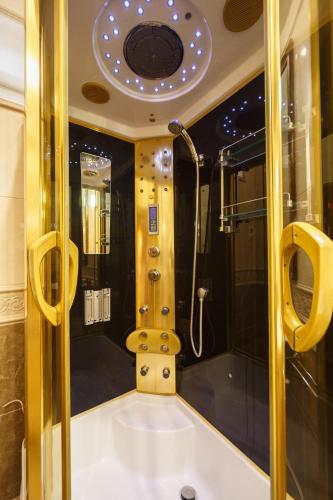 a bathroom with a shower and a tub in a room at Hostel Suputnyk in Lviv