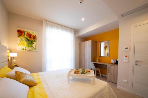 Ένα ή περισσότερα κρεβάτια σε δωμάτιο στο Apart-Hotel la Rocchetta