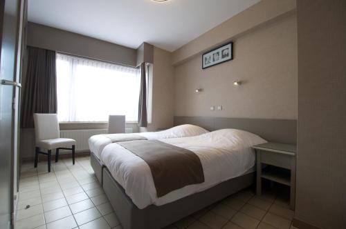 Postel nebo postele na pokoji v ubytování Hotel De Golf