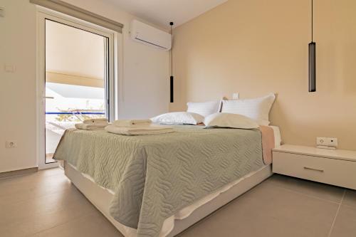 A bed or beds in a room at Best Seaview Attica