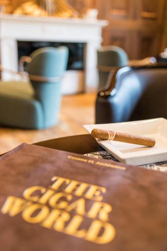 a cigar sitting on top of a table at Wellnessresidenz Alpenrose in Maurach