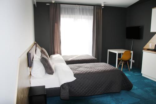 Ένα ή περισσότερα κρεβάτια σε δωμάτιο στο Lemon Plaza Hotel