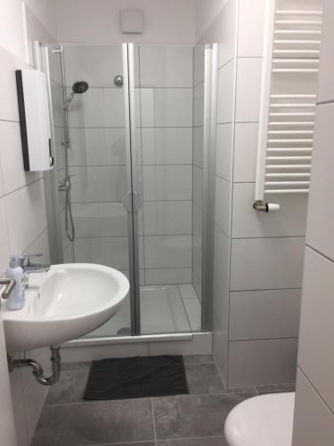 a bathroom with a shower and a sink at Tina in Heiligenhaus
