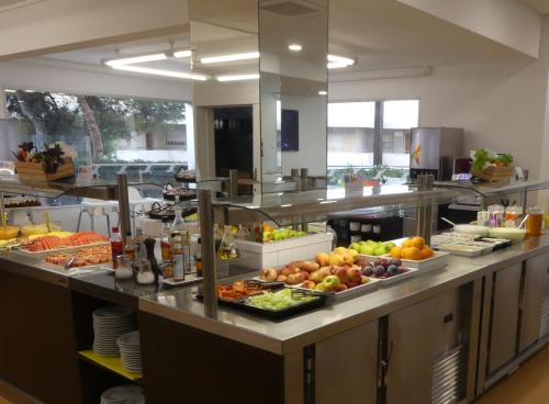 a kitchen with a bunch of food on a counter at Albatros Family in Salou