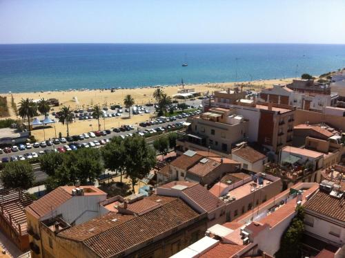an aerial view of a city and the beach at Sa Voga Hotel & Spa in Arenys de Mar