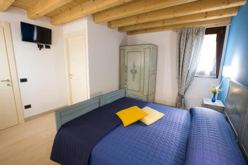 Ένα ή περισσότερα κρεβάτια σε δωμάτιο στο Casa Sansovino