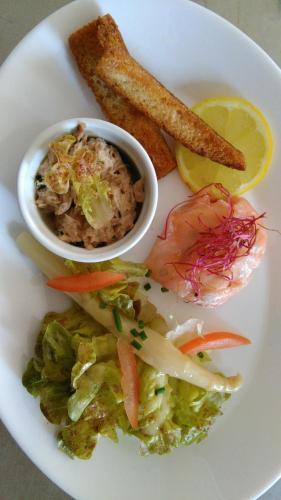 a plate of food with a salad and a bowl of food at Clair de Lie in Vallet