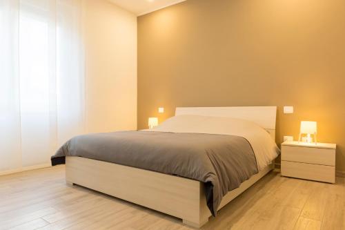 Postel nebo postele na pokoji v ubytování Minisuite Zefiro-Intero appartamento ad uso esclusivo by Appartamenti Petrucci