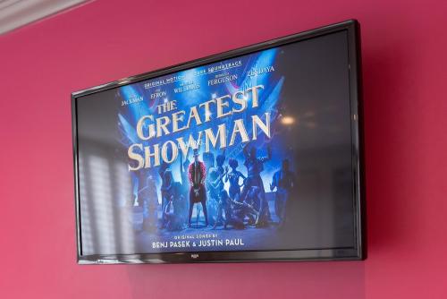 a flat screen tv hanging on a wall at Central Station Hotel Liverpool in Liverpool