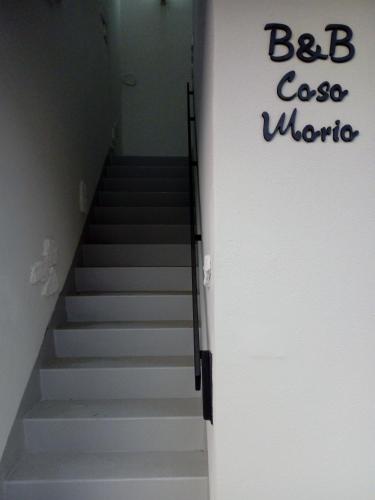 a staircase with a sign that says bc caico wrong at Casa Maria in Cantù