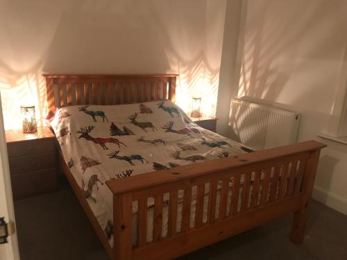 Postel nebo postele na pokoji v ubytování Carrick Hills Cosy Croft