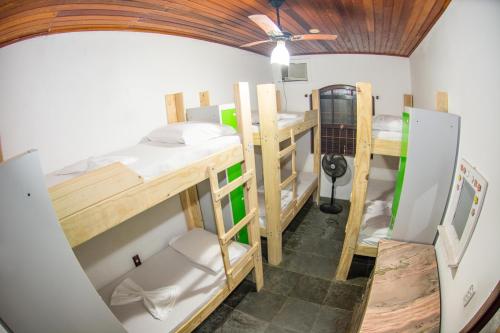 a group of bunk beds in a room at Social Ilha Grande Hostel in Abraão