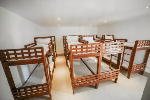 a group of bunk beds in a room at Bataan White Corals Beach Resort in Morong
