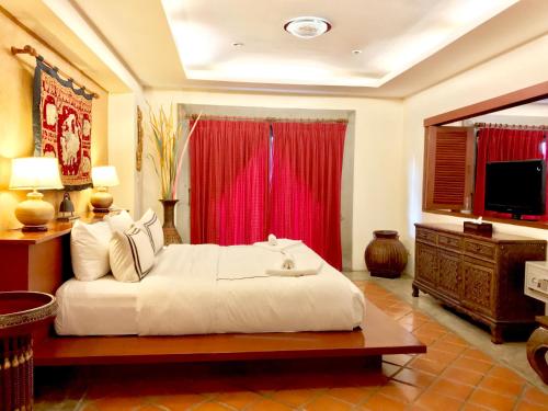 Ένα ή περισσότερα κρεβάτια σε δωμάτιο στο Nirvana Boutique Suites
