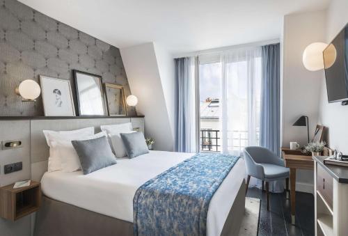 Ein Bett oder Betten in einem Zimmer der Unterkunft Best Western Plus La Demeure