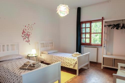 Łóżko lub łóżka w pokoju w obiekcie Casa Ferruccio - Pesaro