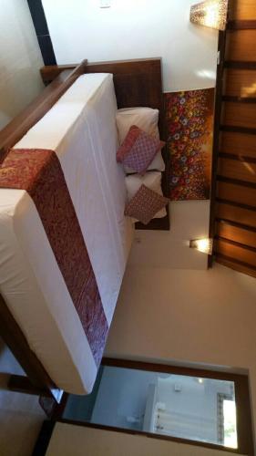 a view of a bedroom with a bed in a room at Swara Homestay 2 in Nusa Lembongan