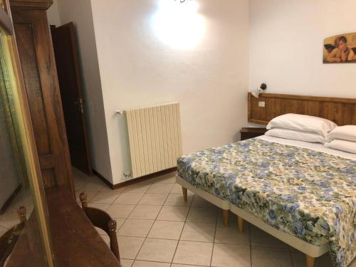Appartamenti Villa Pegaso tesisinde bir odada yatak veya yataklar