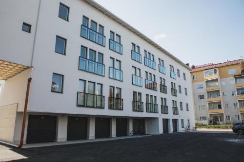 a white building with a lot of windows at First aparthotel Blitzen in Rovaniemi