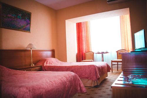 Postelja oz. postelje v sobi nastanitve Hotel Belyy Lotos
