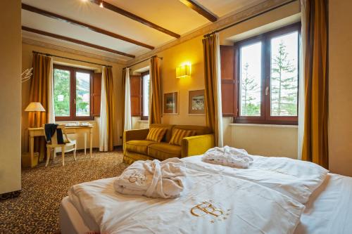 Postel nebo postele na pokoji v ubytování Relais Ducale Spa & Pool
