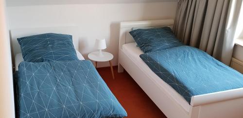 Postel nebo postele na pokoji v ubytování FeWo-Veronika-Apen