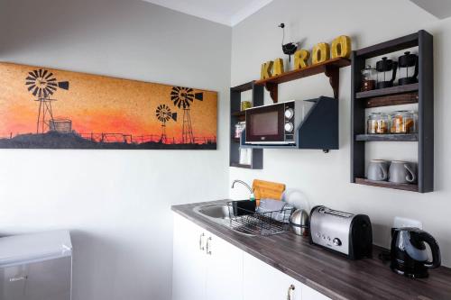 Η κουζίνα ή μικρή κουζίνα στο Arbour1 Guesthouse