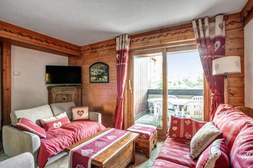 Ένα ή περισσότερα κρεβάτια σε δωμάτιο στο Residence Les Fermes de Meribel - maeva Home