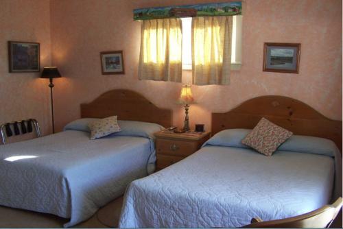 Katil atau katil-katil dalam bilik di Wells River Motel